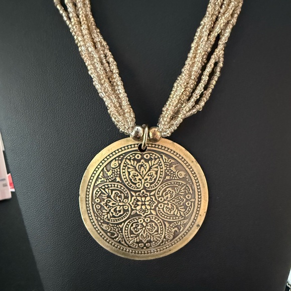 Tribal vintage gold tone 7 strand 16” beaded necklace with round pendant. - Picture 3 of 6